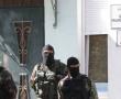 Фото:  Российские силовики у захваченного здания Меджлися крымских татар, Симфер