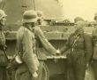 Фото:  Встреча союзников. Немецкие солдаты и советский танкист приветствуют друг